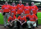 Why at the &#8216;City Ground&#8217; ?  It seems that Malcolm Cambell (back row, middle) European Distribution Manager with Microchip and Glen Jarrett, (front row, left) share a passion for Notts Forest, although the latter is restricted to following the team via the Internet from his home in Phoenix, Arizona.  But that does not explain why they borrowed the shirts ....